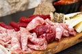 Rustic Tuscan tray with typical products: prosciutto ham, brawn, finocchiona, crostini, salami, tuscan chilli and sliced pecorino Royalty Free Stock Photo